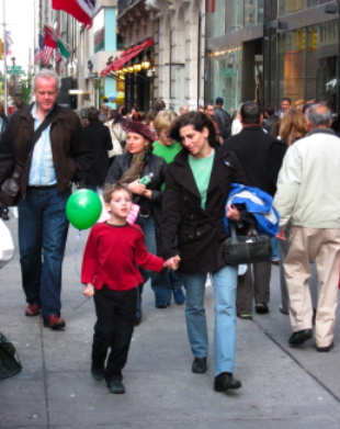 Crowds walking down 5th Ave. in New York City.