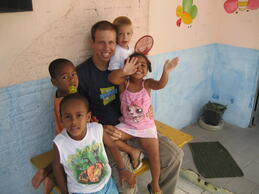 A volunteer with orphans in Brazil