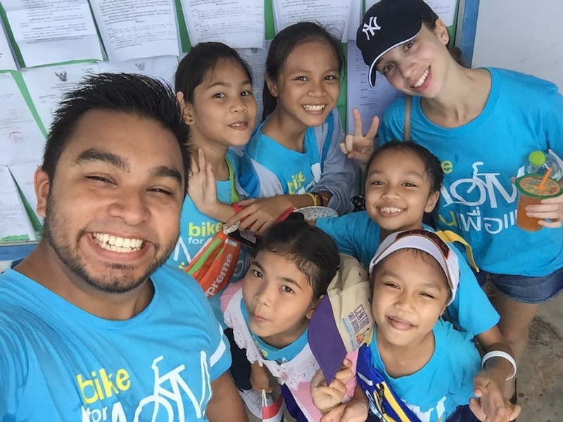 A Cultural Exchange Project teacher in Thailand with his students.