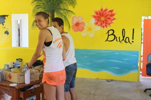 Two GeoVisions volunteers abroad in Fiji working on a renovation project for a classroom in their town.