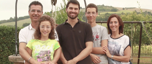 a homestay english tutor posing for a family photo in Italy