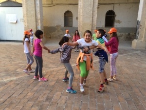 Day campers in Italy playing English games outside at the language camp.