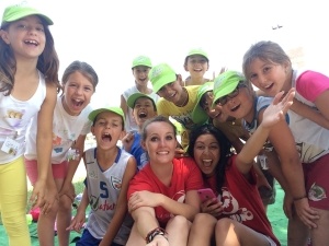 A GeoVisions Foundation language camp counselor with her day campers learning English.