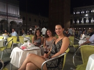 While the family was on vacation, Kayla traveled through Italy. This picture is in the Piazza San Marco in Venice with two other Canadians she met.