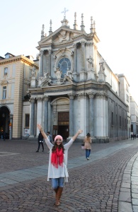 A GeoVisions au pair in Italy in front of a church.