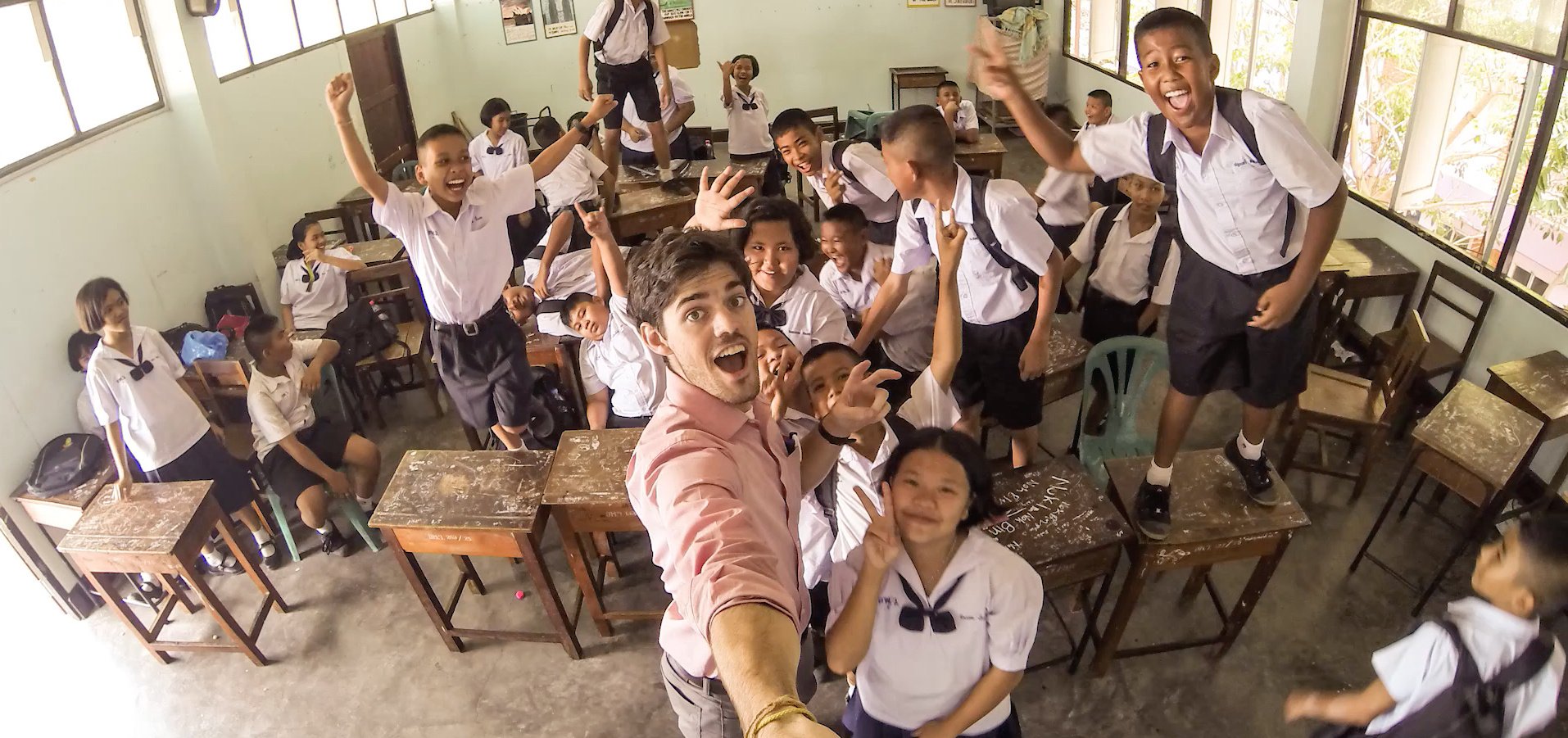 A CEP Teacher in a Thailand classroom with his students.